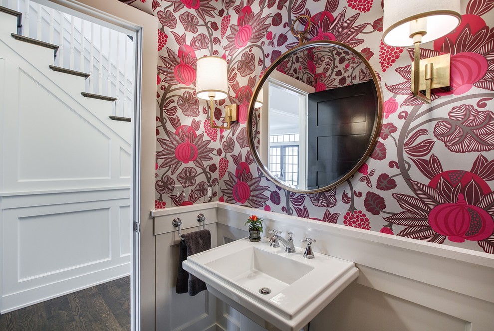 Example of a small transitional powder room design in Minneapolis with pink walls and a pedestal sink