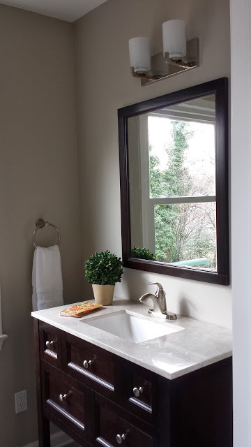 Design ideas for a small classic cloakroom in DC Metro with freestanding cabinets, dark wood cabinets, grey walls, a submerged sink and engineered stone worktops.