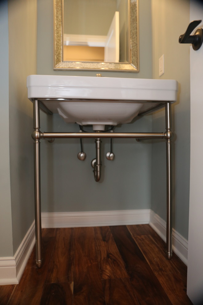 Photo of a small classic cloakroom in Chicago with a pedestal sink and dark hardwood flooring.