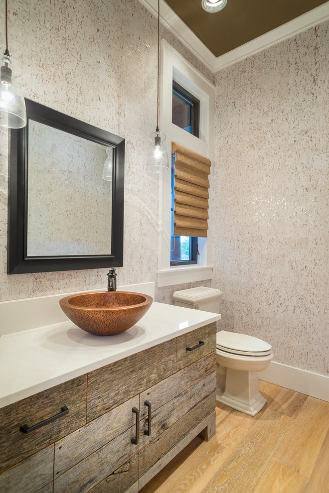 Example of a transitional powder room design in Portland with a vessel sink and white countertops