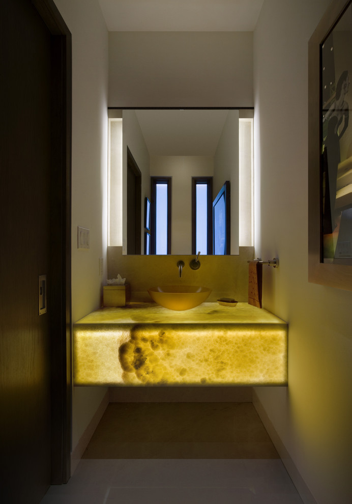 Inspiration for a contemporary powder room remodel in Denver with a vessel sink