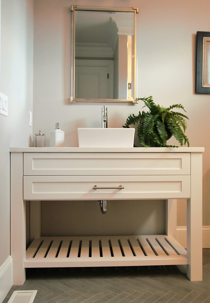 This is an example of a medium sized scandi cloakroom in Boston with white cabinets, freestanding cabinets, grey walls, cement flooring, a vessel sink, wooden worktops, grey floors and white worktops.