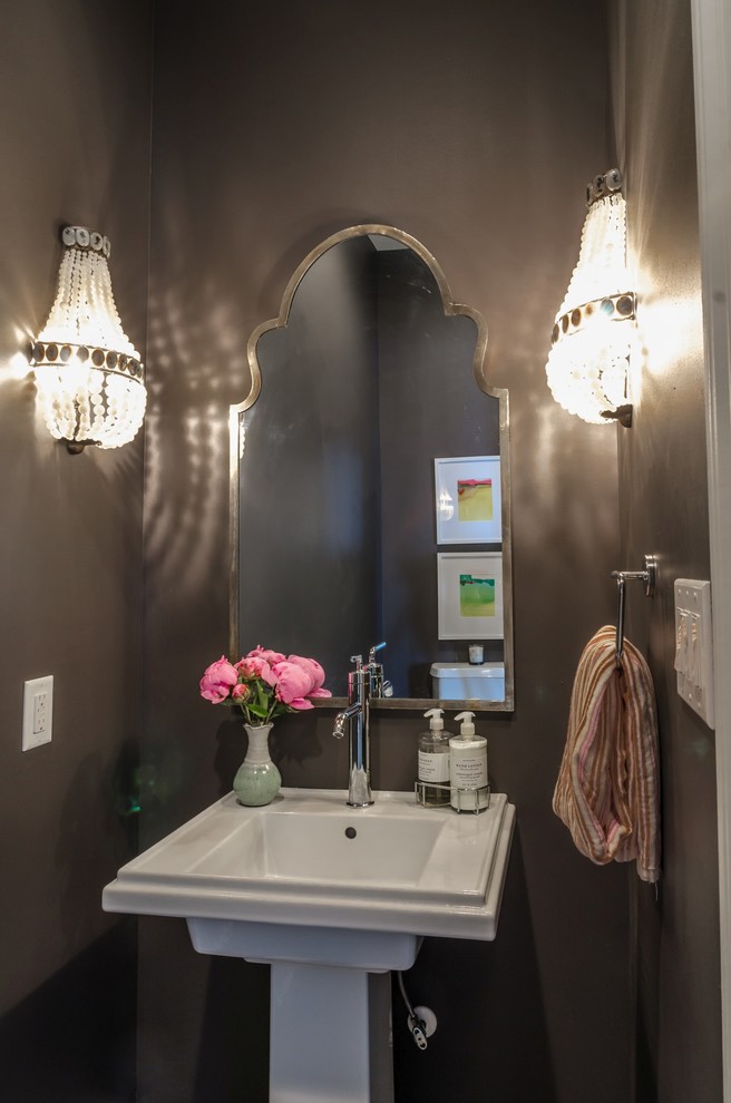 Mid-sized elegant brown tile powder room photo in Miami with brown walls and a pedestal sink