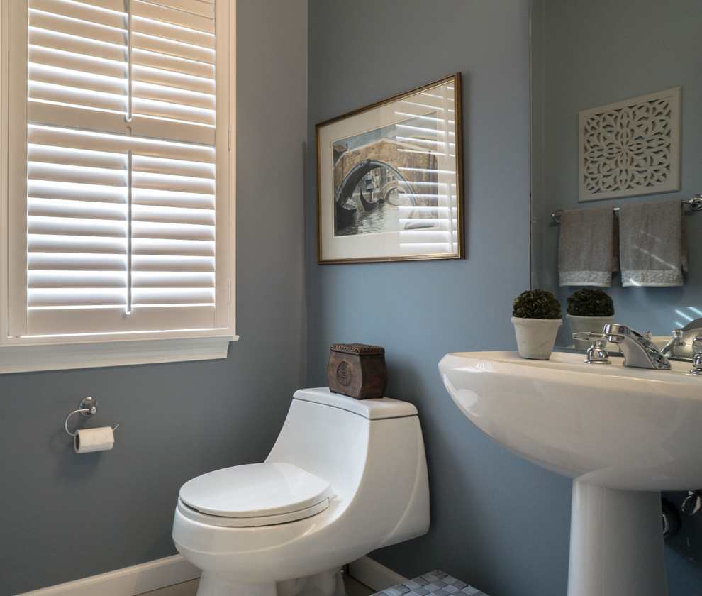 Design ideas for a medium sized traditional cloakroom in Bridgeport with a one-piece toilet, blue walls, ceramic flooring and a pedestal sink.
