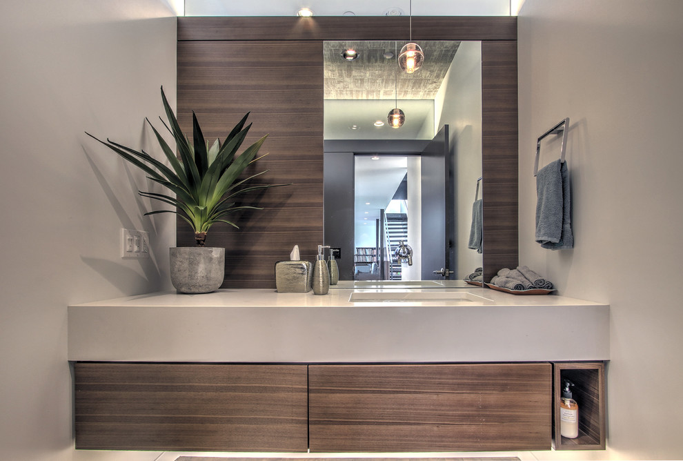 Contemporary cloakroom in Seattle with a submerged sink, flat-panel cabinets, dark wood cabinets, engineered stone worktops, medium hardwood flooring and grey walls.