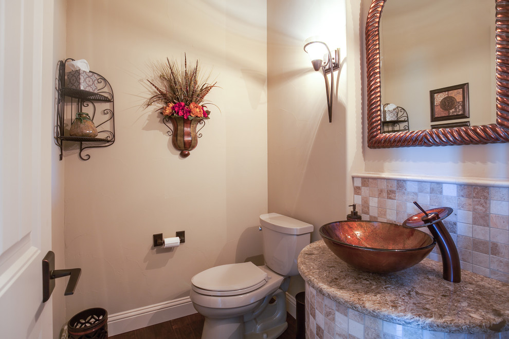 This is an example of a small classic cloakroom in Dallas with beige tiles, ceramic tiles, beige walls, medium hardwood flooring, a vessel sink and granite worktops.