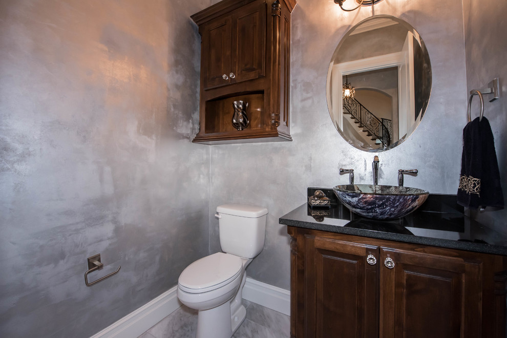 Example of a tuscan powder room design in Other