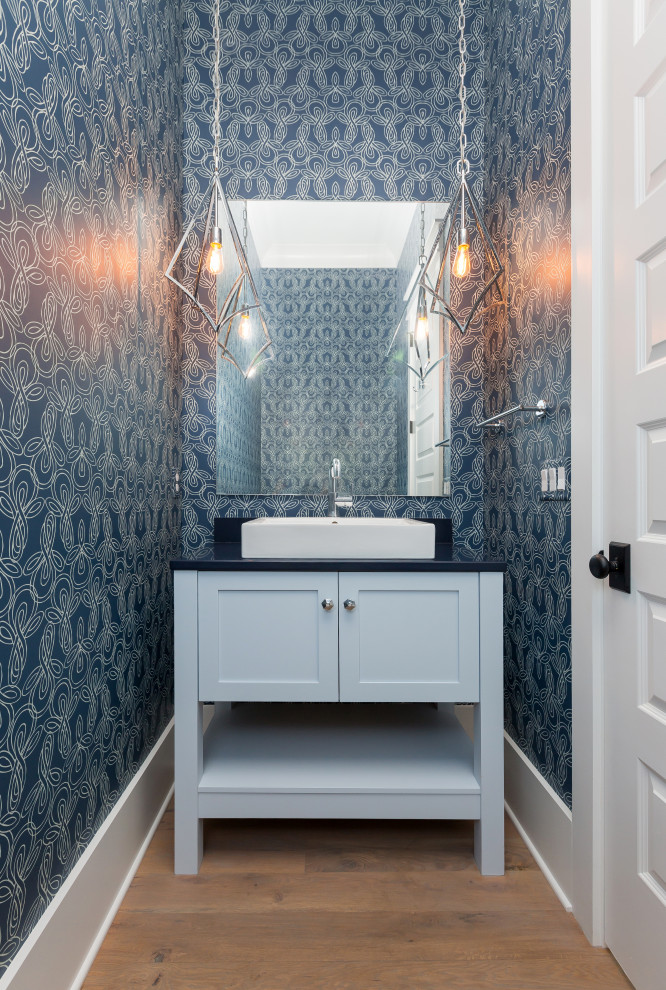 Example of a beach style powder room design in Charleston