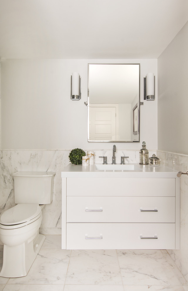 Classic cloakroom in Toronto with flat-panel cabinets, white cabinets and marble tiles.