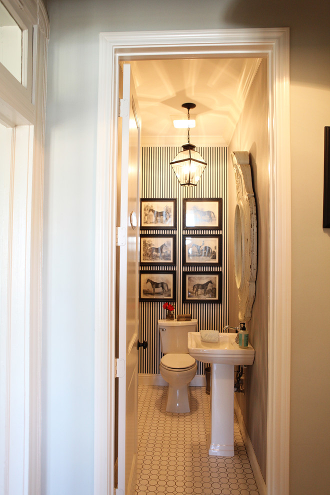 Inspiration for a small cottage powder room remodel in Austin with a pedestal sink and multicolored walls