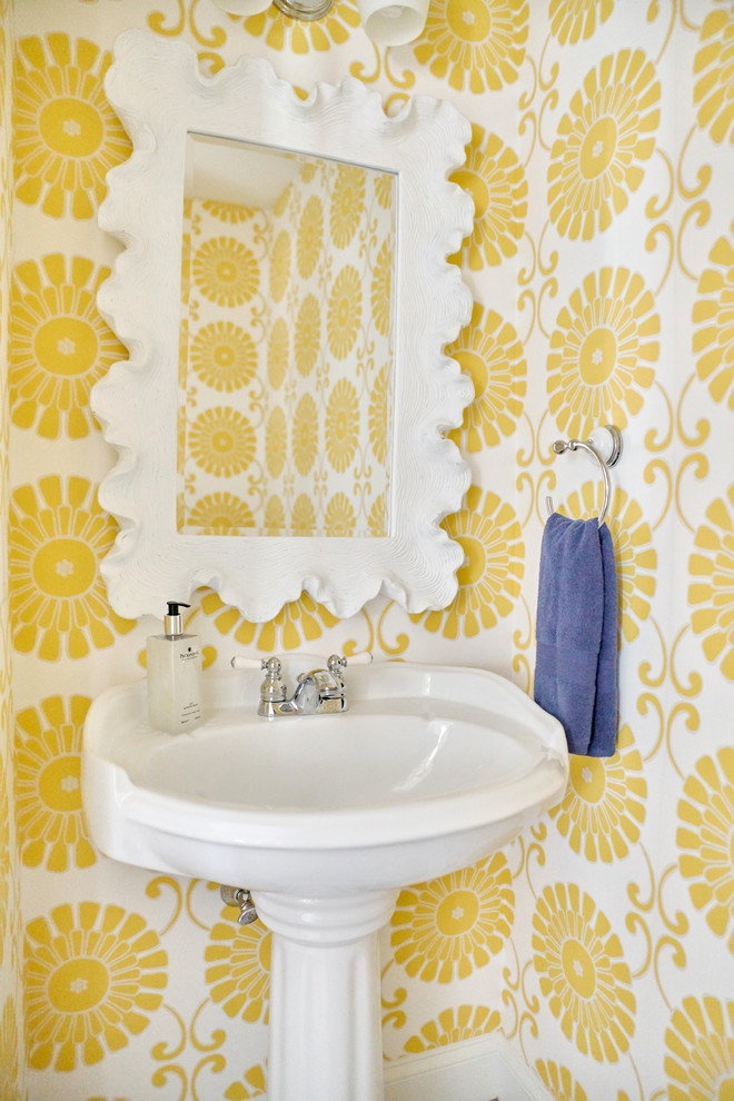 Inspiration for a small transitional light wood floor and beige floor powder room remodel in Providence with a one-piece toilet, yellow walls and a pedestal sink
