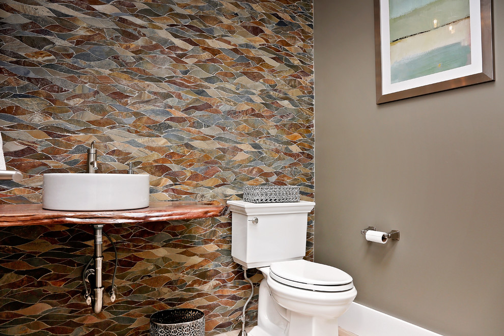 Photo of a medium sized traditional cloakroom in Other with open cabinets, multi-coloured tiles, slate tiles, light hardwood flooring, a built-in sink, wooden worktops and beige floors.