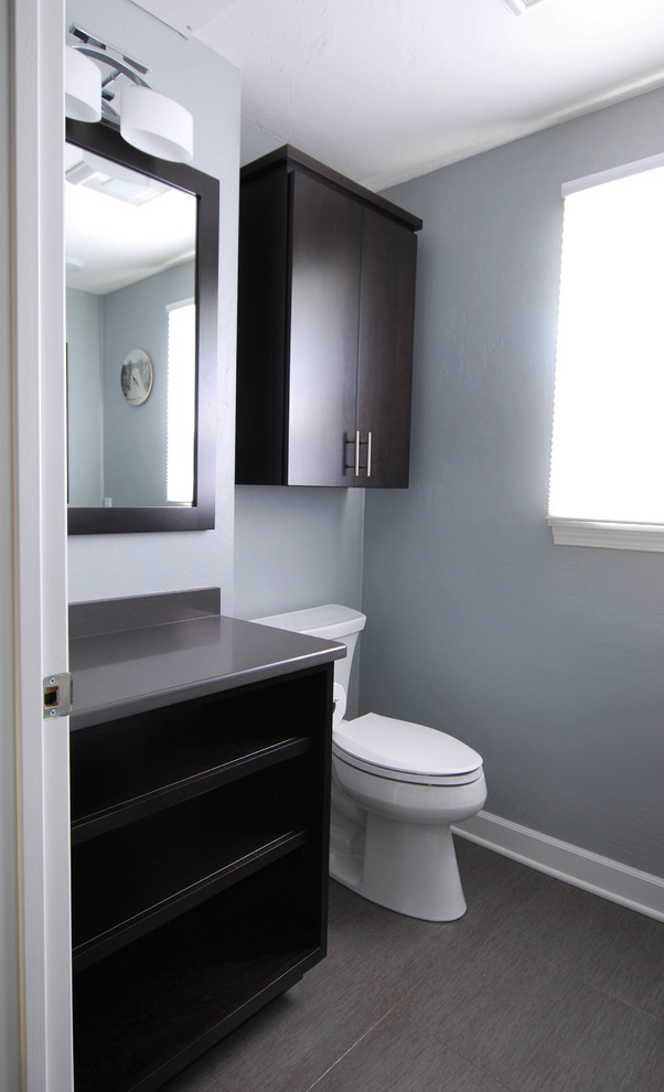 Design ideas for a contemporary cloakroom in Other with open cabinets, black cabinets, grey tiles, porcelain tiles, blue walls, vinyl flooring, a submerged sink, quartz worktops and grey floors.