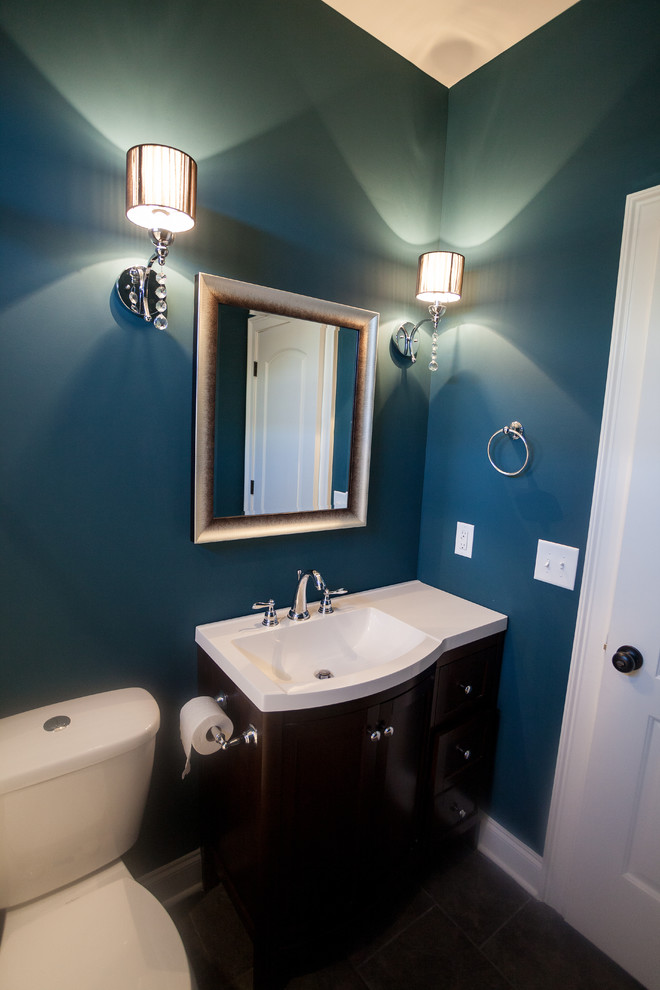 Small transitional powder room photo in Nashville with an integrated sink, shaker cabinets, dark wood cabinets, a two-piece toilet and green walls