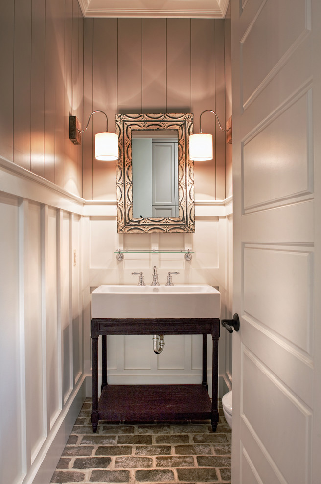 Design ideas for a medium sized classic cloakroom in Atlanta with brick flooring, freestanding cabinets, dark wood cabinets, grey walls, a trough sink and grey floors.