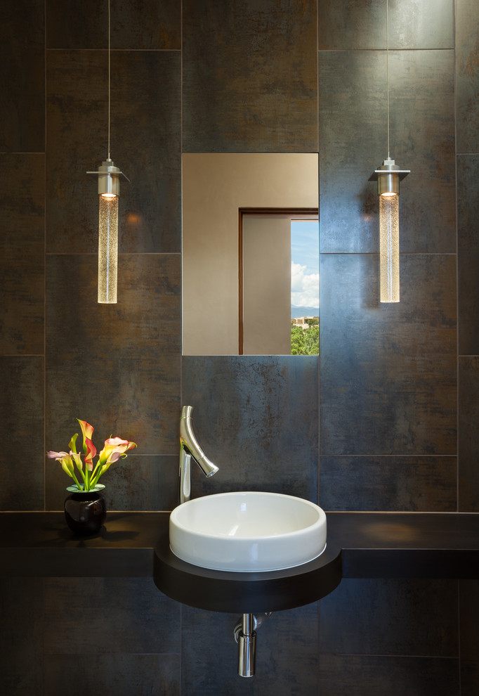 Trendy powder room photo in Albuquerque with a vessel sink