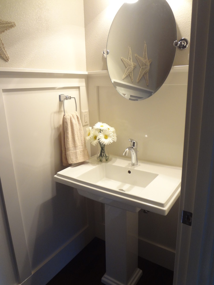 Powder room - mid-sized craftsman powder room idea in Portland with white walls and a pedestal sink