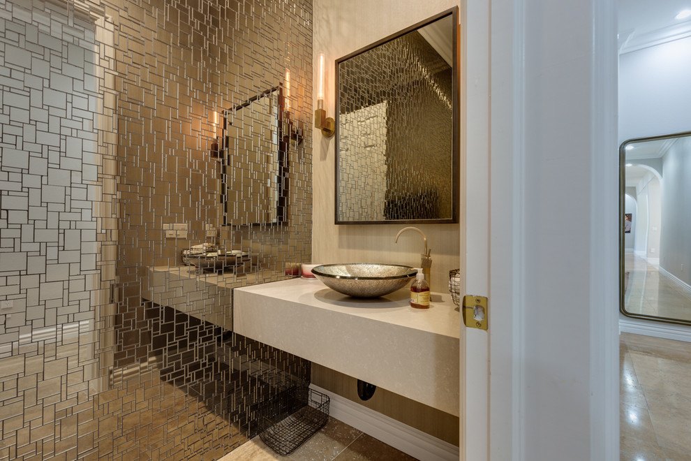 Design ideas for a contemporary cloakroom in Las Vegas with mosaic tiles, beige walls, a vessel sink, beige floors and beige worktops.