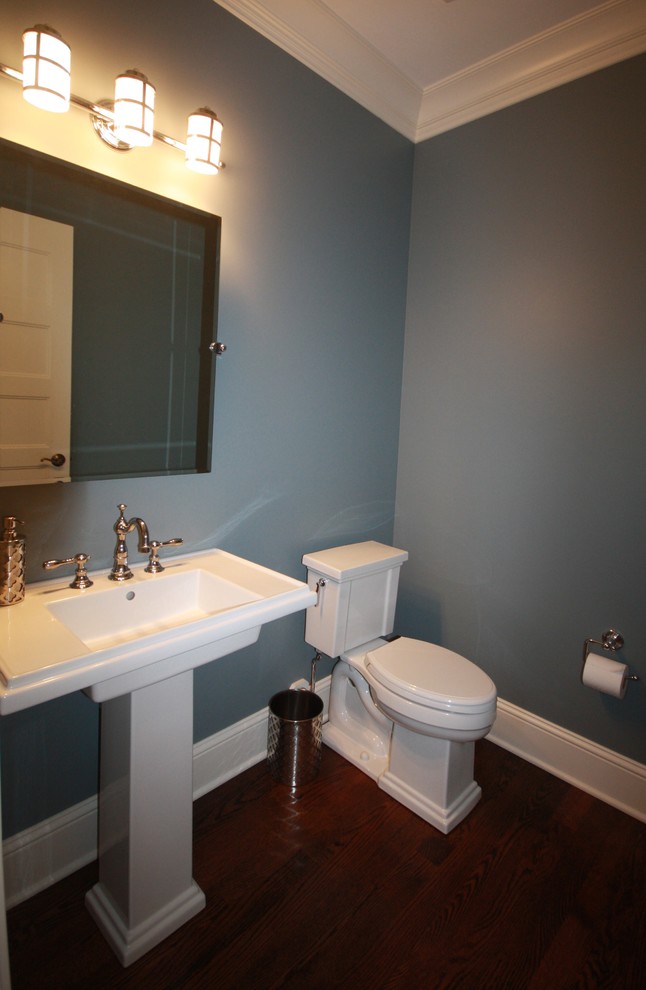 Small elegant dark wood floor and brown floor powder room photo in Chicago with a two-piece toilet, gray walls and a pedestal sink