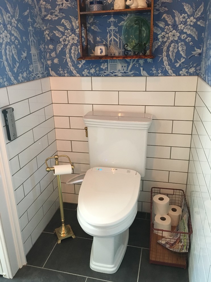 This is an example of a cloakroom in Raleigh with a two-piece toilet, white tiles, porcelain tiles, blue walls and slate flooring.