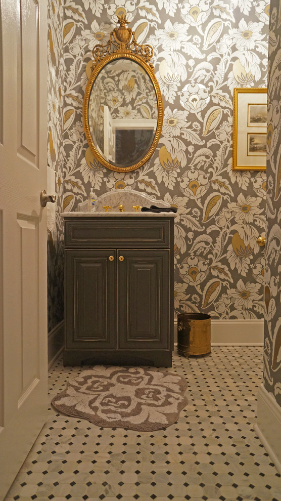Example of a small classic black and white tile and stone tile marble floor powder room design in Philadelphia with raised-panel cabinets, distressed cabinets, a two-piece toilet, multicolored walls, an undermount sink and marble countertops