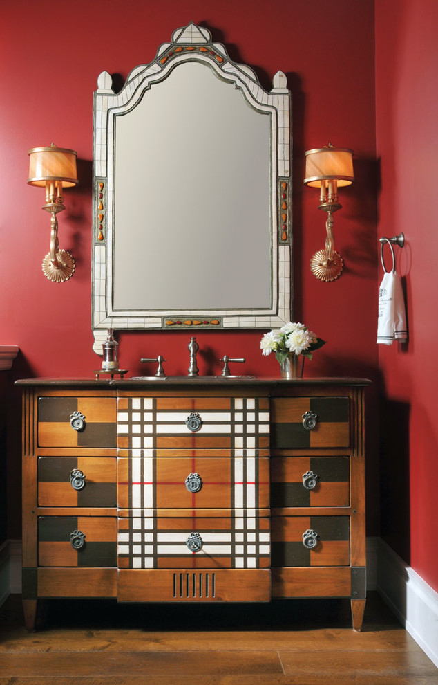 Inspiration for a traditional cloakroom in New York with a submerged sink, freestanding cabinets, wooden worktops, red walls and dark hardwood flooring.