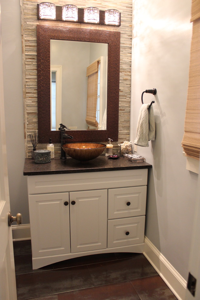 Mid-sized elegant multicolored tile and stone tile ceramic tile powder room photo in Bridgeport with raised-panel cabinets, white cabinets, a two-piece toilet, a vessel sink and granite countertops