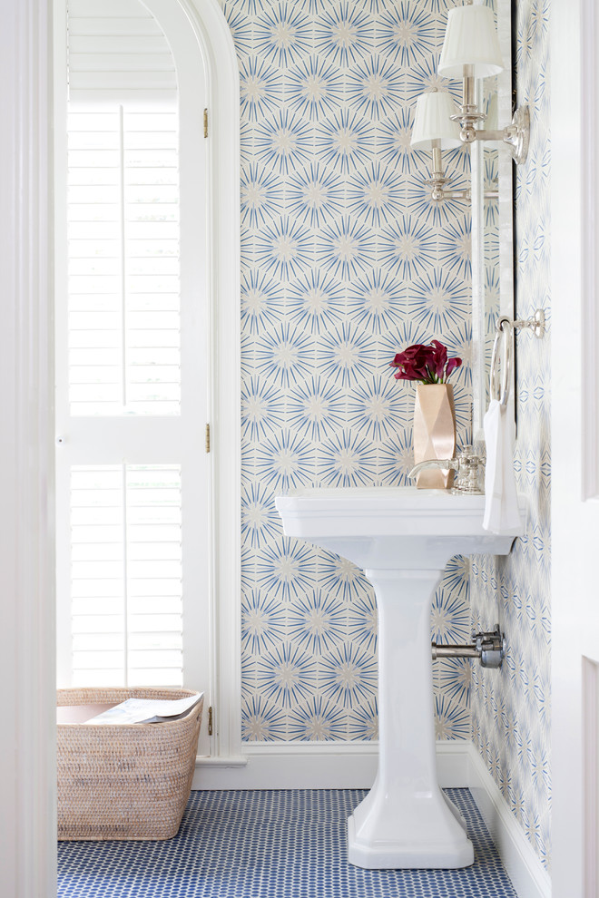Inspiration for a transitional ceramic tile powder room remodel in DC Metro with a pedestal sink and multicolored walls