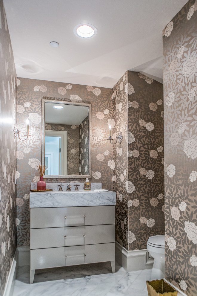 Example of a transitional marble floor powder room design in Dallas with flat-panel cabinets, gray cabinets, marble countertops and multicolored walls