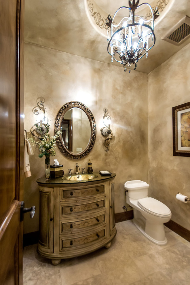Ejemplo de aseo mediterráneo con paredes beige, lavabo integrado, armarios tipo mueble y baldosas y/o azulejos beige