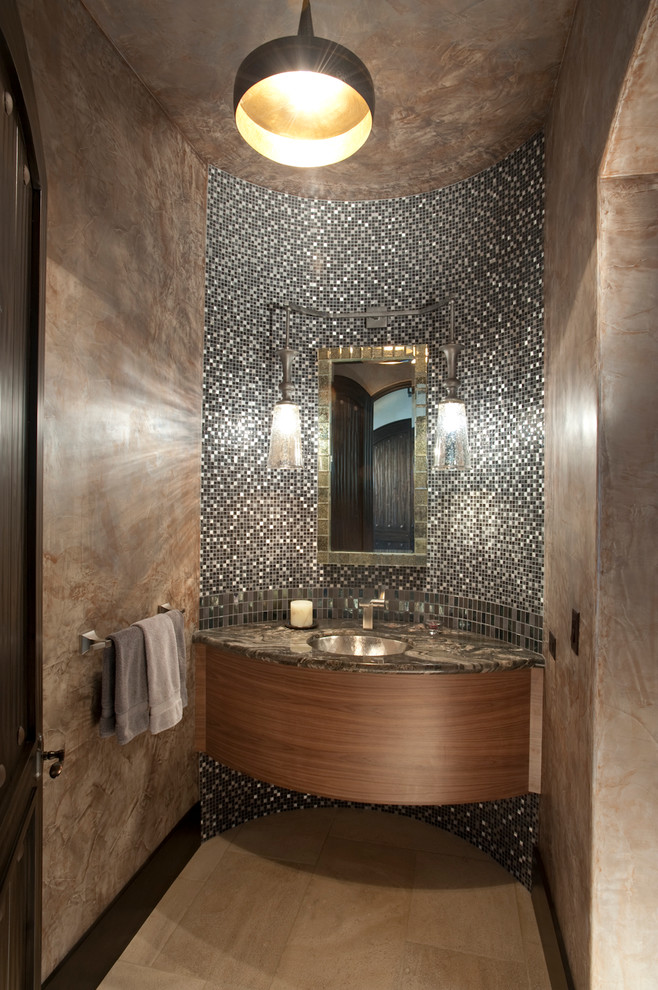 Photo of a medium sized mediterranean cloakroom in San Francisco with a submerged sink, flat-panel cabinets, black and white tiles, beige tiles, mosaic tiles, grey walls, ceramic flooring, marble worktops and dark wood cabinets.
