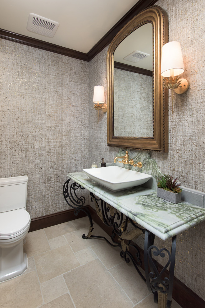 Gästetoilette mit Toilette mit Aufsatzspülkasten, brauner Wandfarbe, Kalkstein, Waschtischkonsole, beigem Boden und grüner Waschtischplatte in Los Angeles