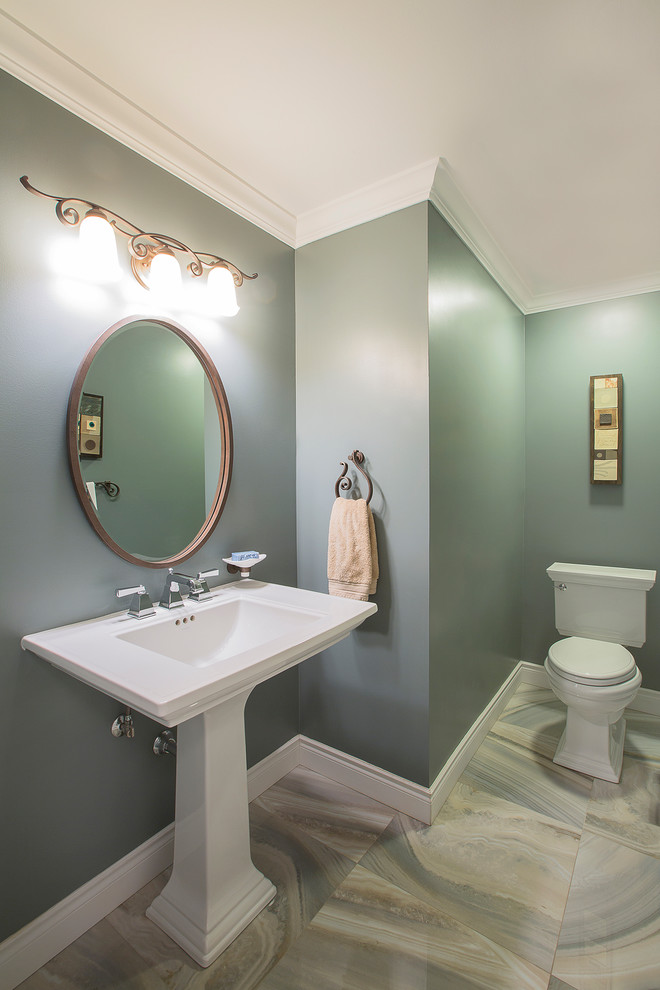 Inspiration for a large traditional cloakroom in Toronto with a pedestal sink, marble flooring, a two-piece toilet and grey tiles.