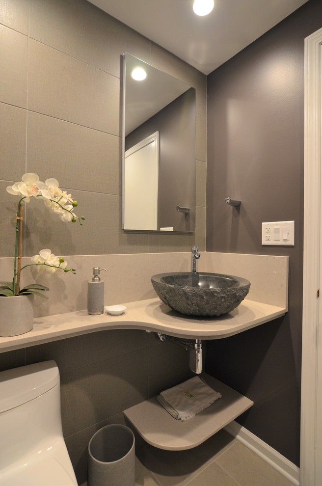 Small modern cloakroom in Chicago with a one-piece toilet, brown tiles, porcelain tiles, purple walls, porcelain flooring, a vessel sink, engineered stone worktops and grey floors.