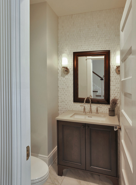 This is an example of a small classic cloakroom in DC Metro with recessed-panel cabinets, dark wood cabinets, a two-piece toilet, beige walls, a submerged sink, engineered stone worktops, white floors and beige worktops.