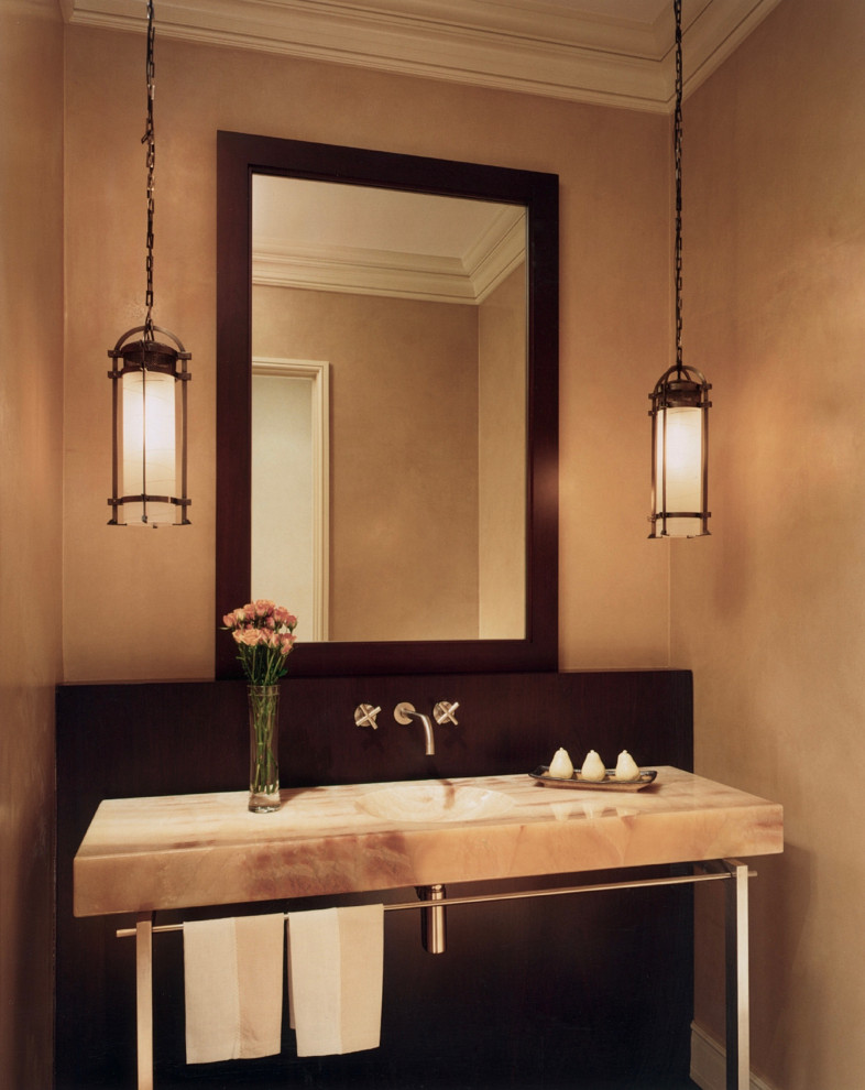 Powder room - mid-sized transitional powder room idea in Chicago with furniture-like cabinets, beige walls, an integrated sink, onyx countertops, beige countertops and a freestanding vanity