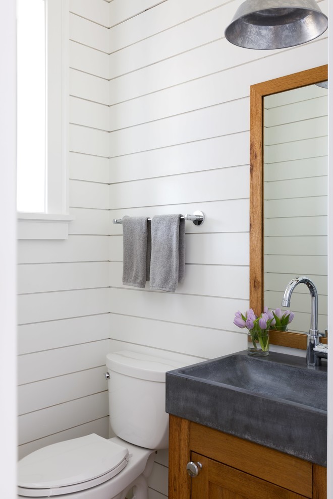 Inspiration for a small country cloakroom in DC Metro with shaker cabinets, medium wood cabinets, white walls, concrete worktops, grey worktops and a console sink.