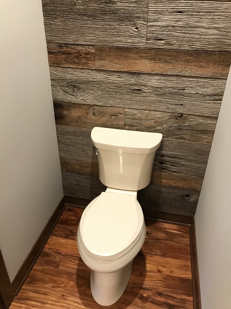 Design ideas for a medium sized traditional cloakroom in Milwaukee with a two-piece toilet, grey walls, dark hardwood flooring and brown floors.