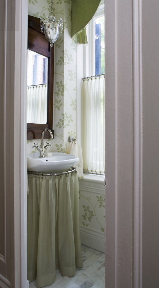 Example of a small classic marble floor and gray floor powder room design in DC Metro with a vessel sink and multicolored walls