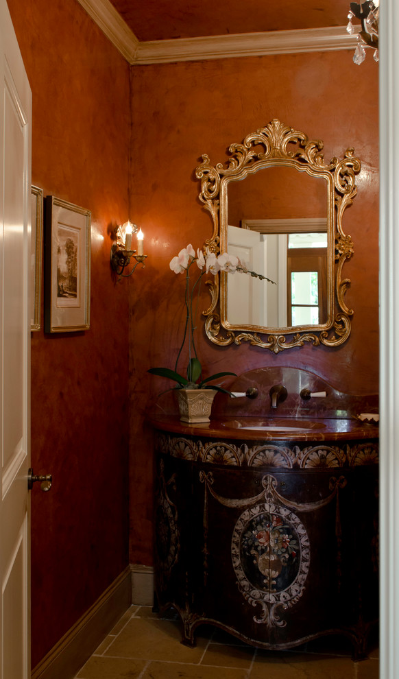 Example of a tuscan powder room design in Austin