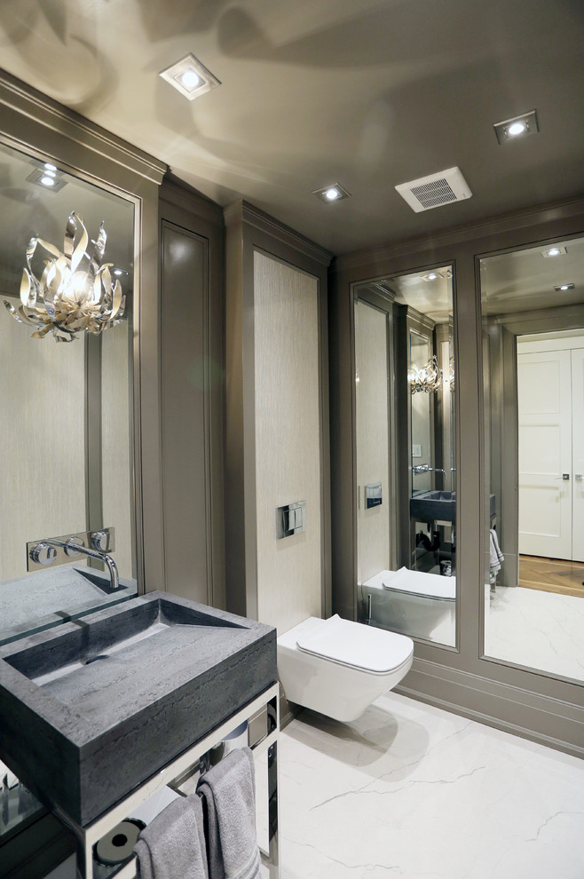 Design ideas for a medium sized contemporary cloakroom in Toronto with open cabinets, a wall mounted toilet, beige walls, marble flooring, an integrated sink and soapstone worktops.