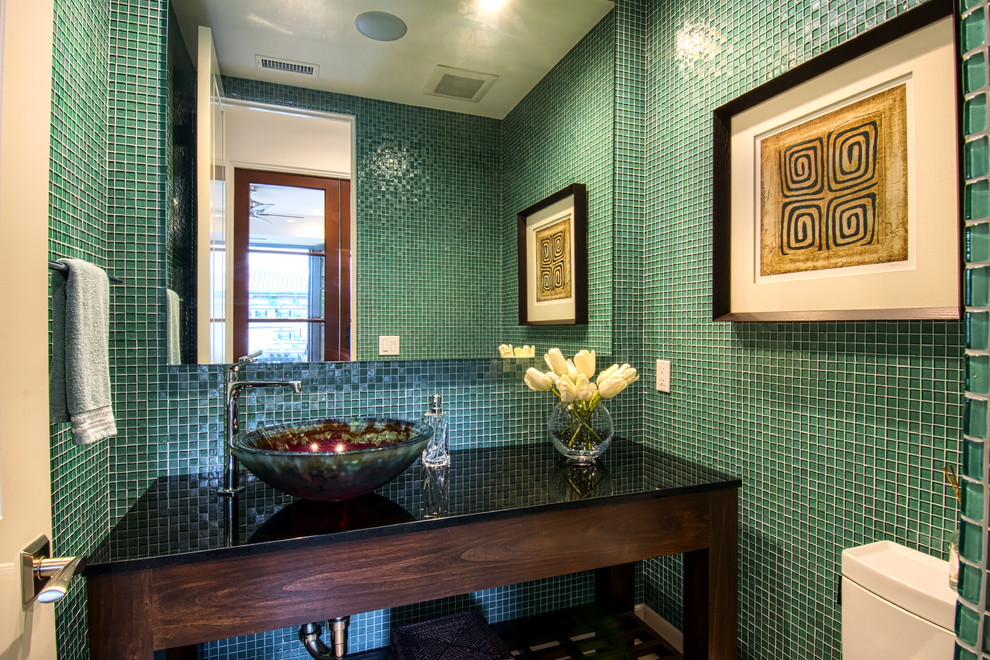Photo of a contemporary cloakroom in Orange County with open cabinets, dark wood cabinets, green tiles, glass tiles, a vessel sink, granite worktops and a one-piece toilet.