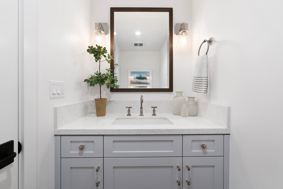 Photo of a small traditional cloakroom in Orange County with white tiles, ceramic tiles, white walls, marble flooring, a submerged sink, marble worktops, shaker cabinets, grey cabinets and white worktops.