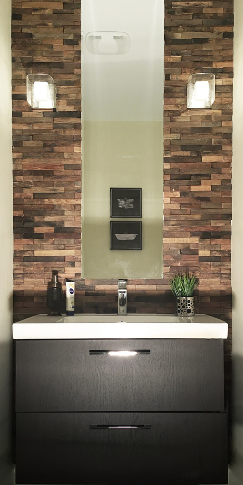 This is an example of a rustic cloakroom in Toronto with flat-panel cabinets, black cabinets, stone tiles and solid surface worktops.