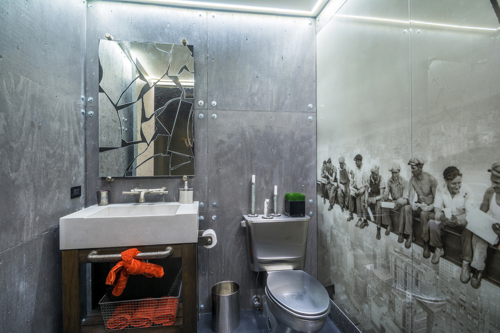 Inspiration for a medium sized industrial cloakroom in New York with a two-piece toilet, grey walls, open cabinets, dark wood cabinets, grey tiles, metal tiles, an integrated sink and quartz worktops.