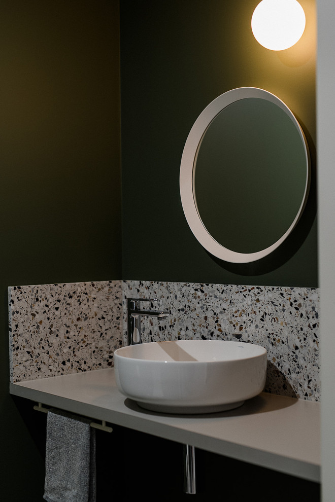 Small contemporary cloakroom in Other with recessed-panel cabinets, grey cabinets, a one-piece toilet, white walls, terrazzo flooring, a vessel sink, laminate worktops, multi-coloured floors, grey worktops and a floating vanity unit.