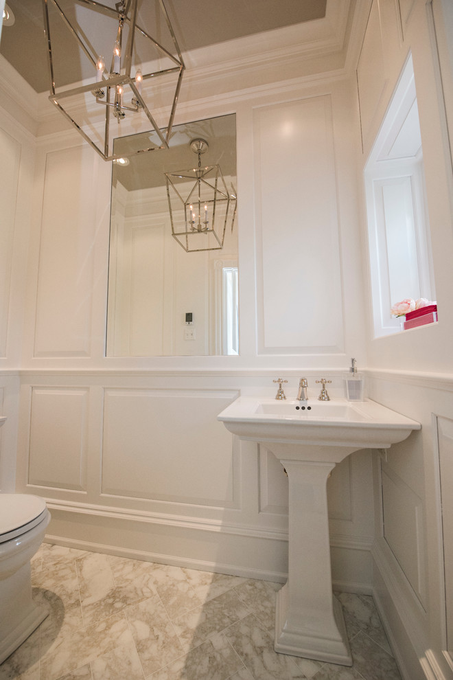 Powder room - small traditional marble floor powder room idea in Philadelphia with white walls and a pedestal sink