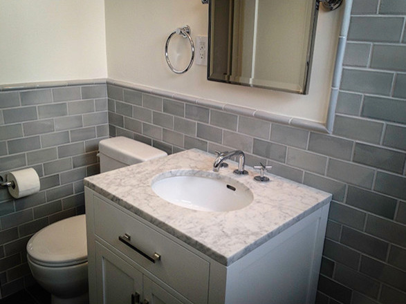 Design ideas for a medium sized classic cloakroom in San Diego with shaker cabinets, white cabinets, a two-piece toilet, grey tiles, ceramic tiles, white walls, a submerged sink and marble worktops.