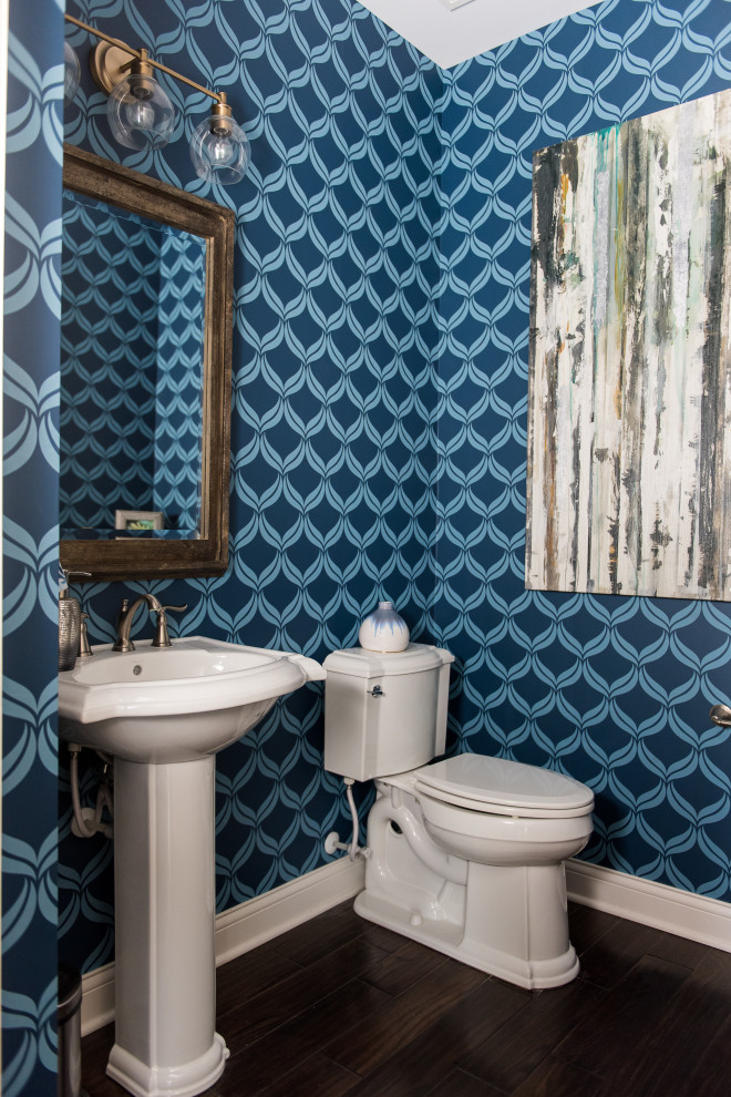 Example of a mid-sized trendy dark wood floor powder room design in Indianapolis with a one-piece toilet and a console sink