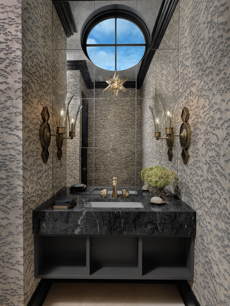 На фото: туалет в стиле неоклассика (современная классика) с открытыми фасадами, черными фасадами, унитазом-моноблоком, мраморным полом, врезной раковиной, мраморной столешницей, черной столешницей, подвесной тумбой и обоями на стенах с